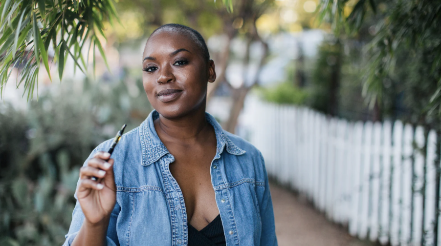 woman smoking a cannabis vape cartridge