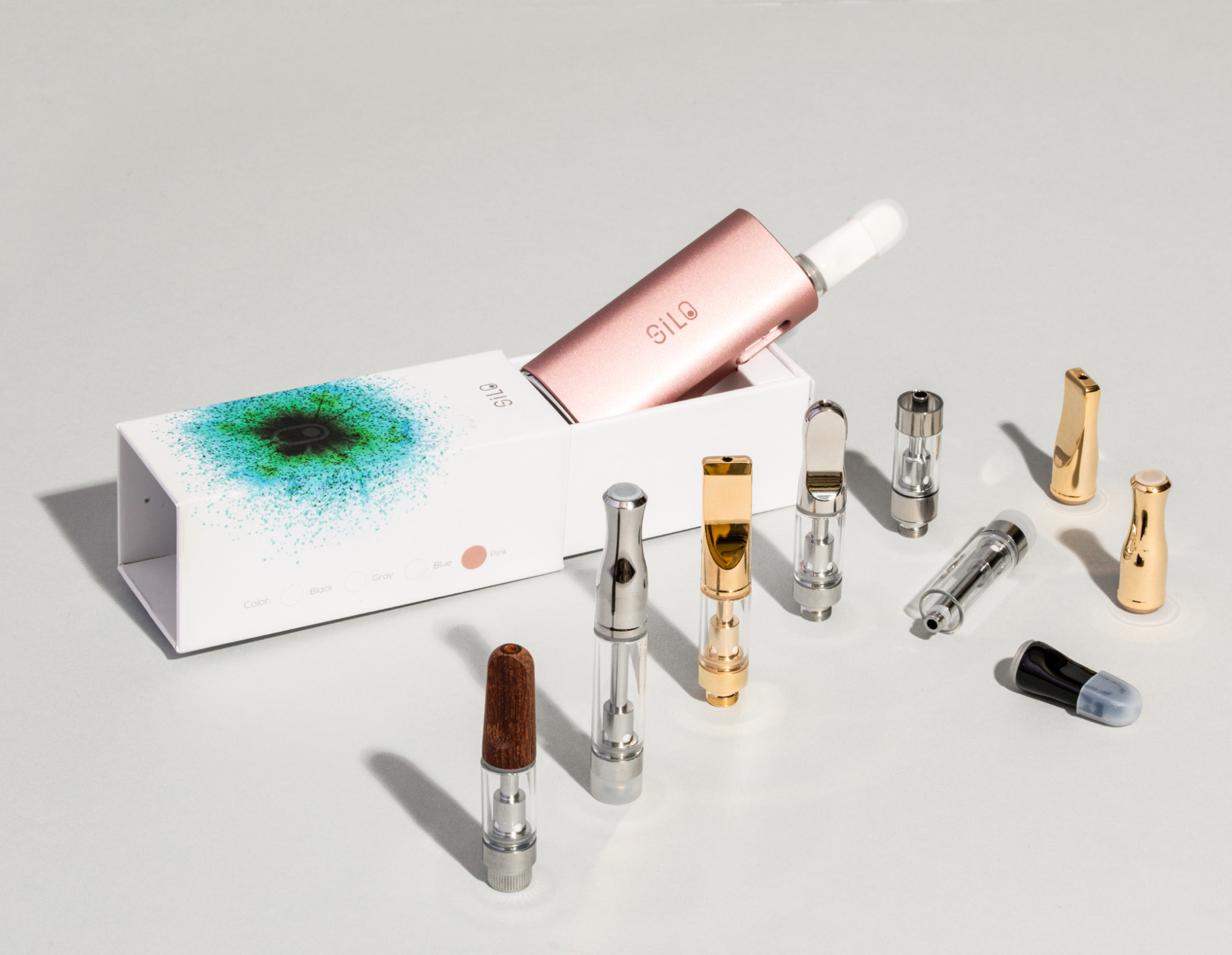 A selection of KushCo’s empty vape cartridges next to a Silo battery